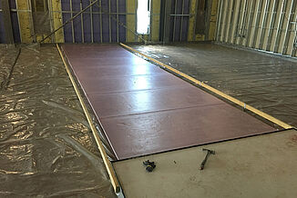 College of the Holy Cross - Panel installation A panel as it is being installed with REGUPOL acoustics in the Joanne Chouinard-Luth Recreation and Wellness Center at the College of the Holy Cross.