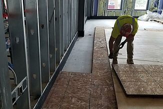 College of the Holy Cross - REGUPOL soundpanel Construction employee installing the REGUPOL soundpanel at the College of the Holy Cross wellness and recreation facility.
