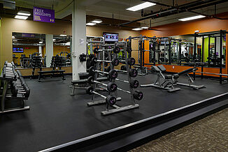 Anytime Fitness - View of Facility View of the Anytime Fitness facility featuring a dumbbell rack, a weight rack and weighted bars. The facility features REGUPOL sonusfit m520 flooring to provide optimal acoustic insulation.