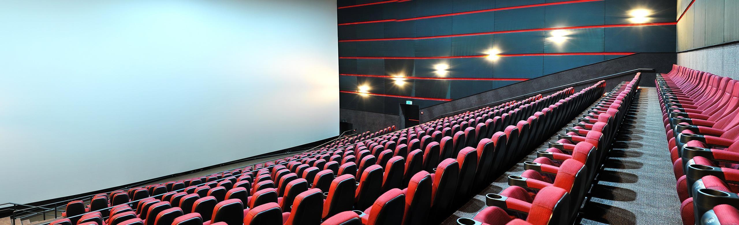 REGUPOL acoustics - Cinema A movie theatering with rows of seats for the audience. The theater features REGUPOL acoustics.Create a comfortable, distraction-free environment in theaters and cinemas with REGUPOL acoustics.